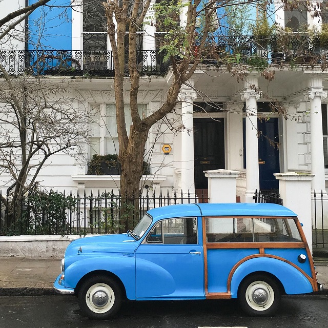 blue car outside house in London
